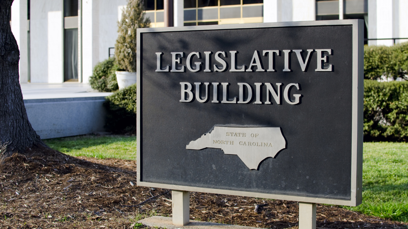 NC Legislative Building sign, where the budget was drafted behind closed doors.