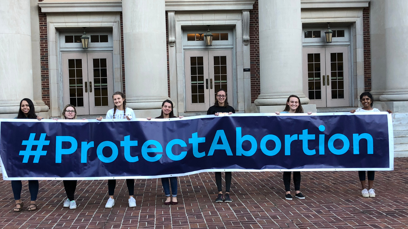 campus leaders holding a #protectabortion banner